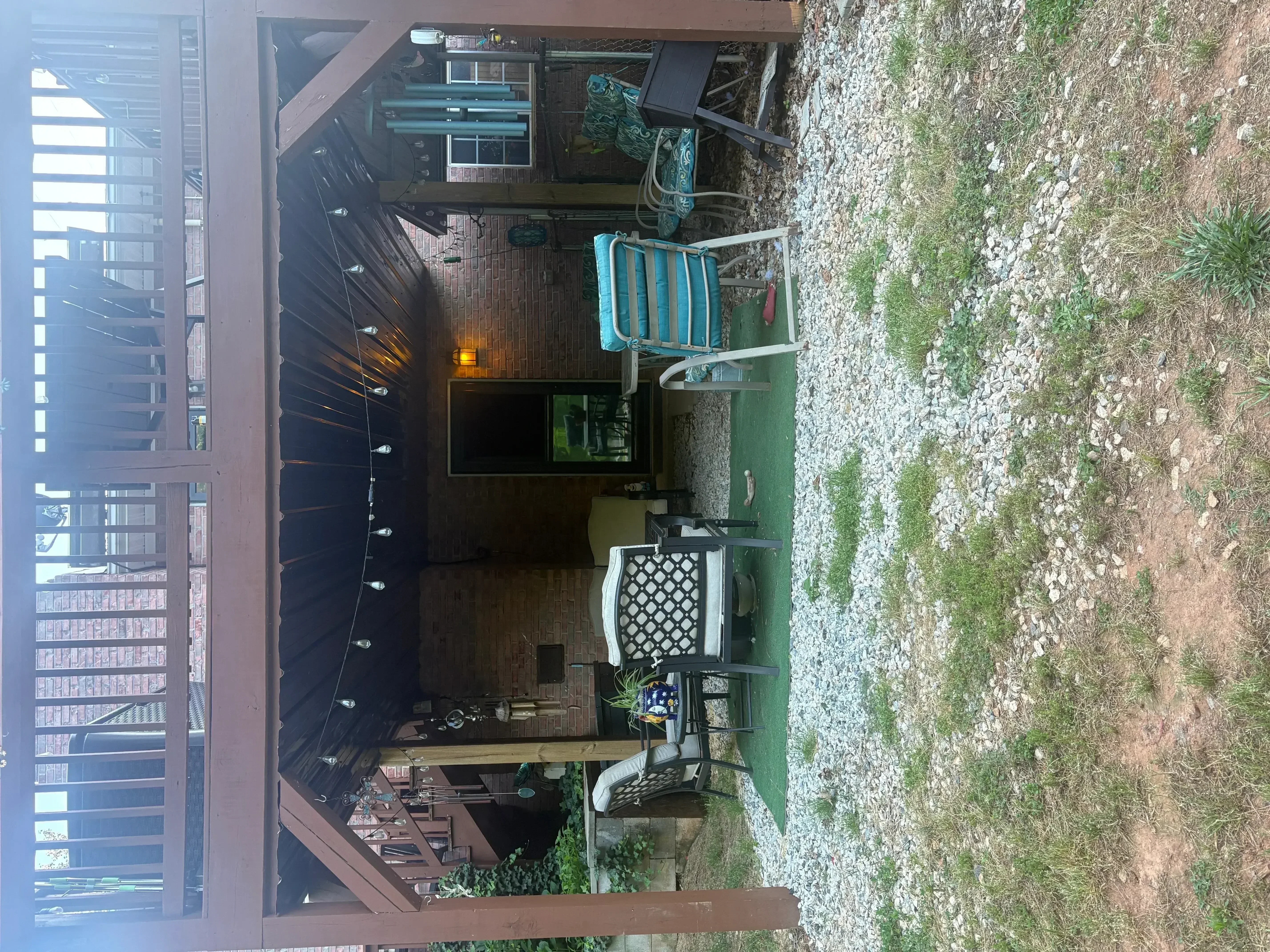 New composite deck with built-in seating, fresh exterior siding, and landscaping